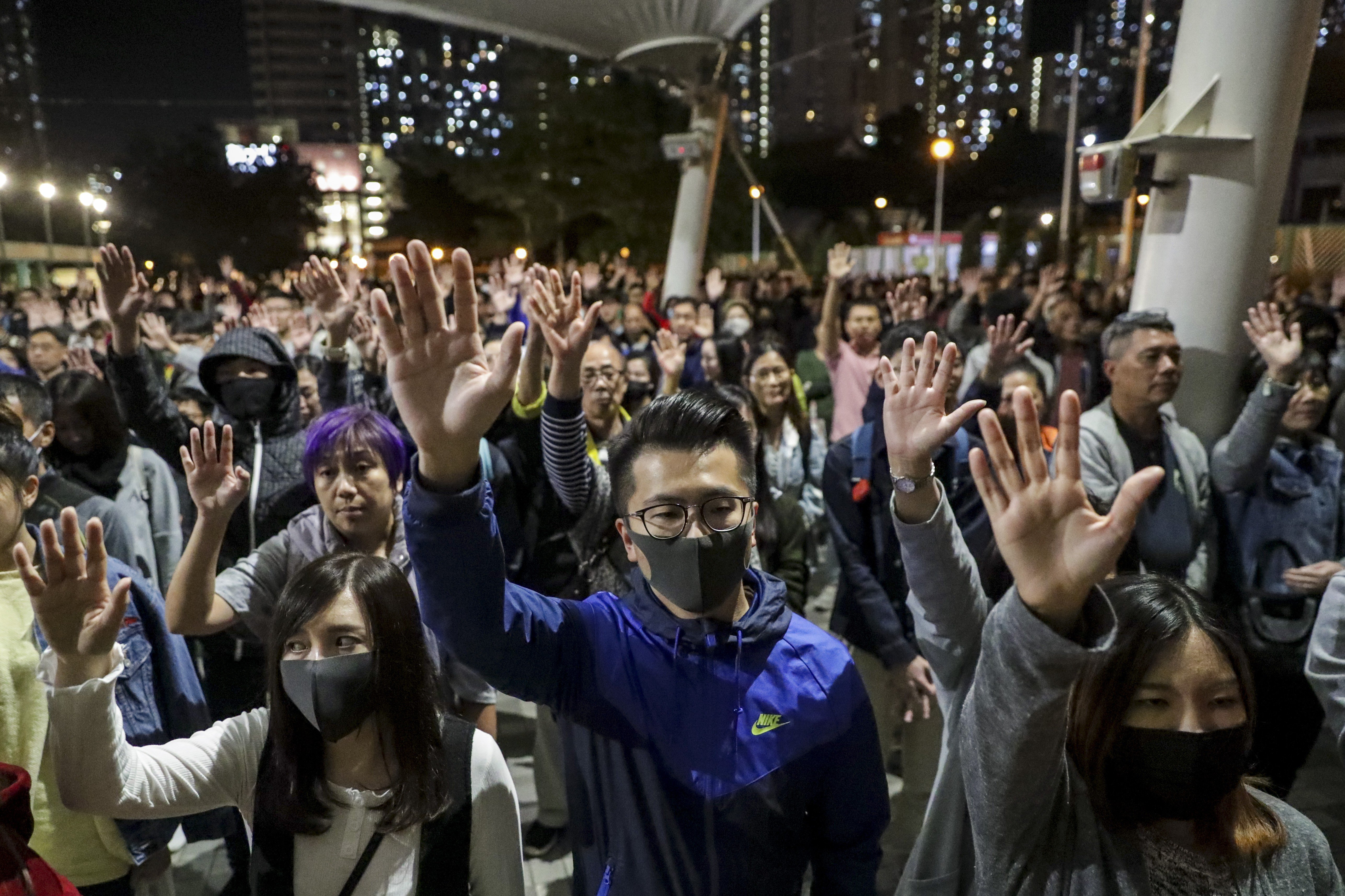 Democracy supporters raise their hands in support of the “five demands” of the protest movement at Wong Tai Sin Plaza on November 30. Photo: Edmond So