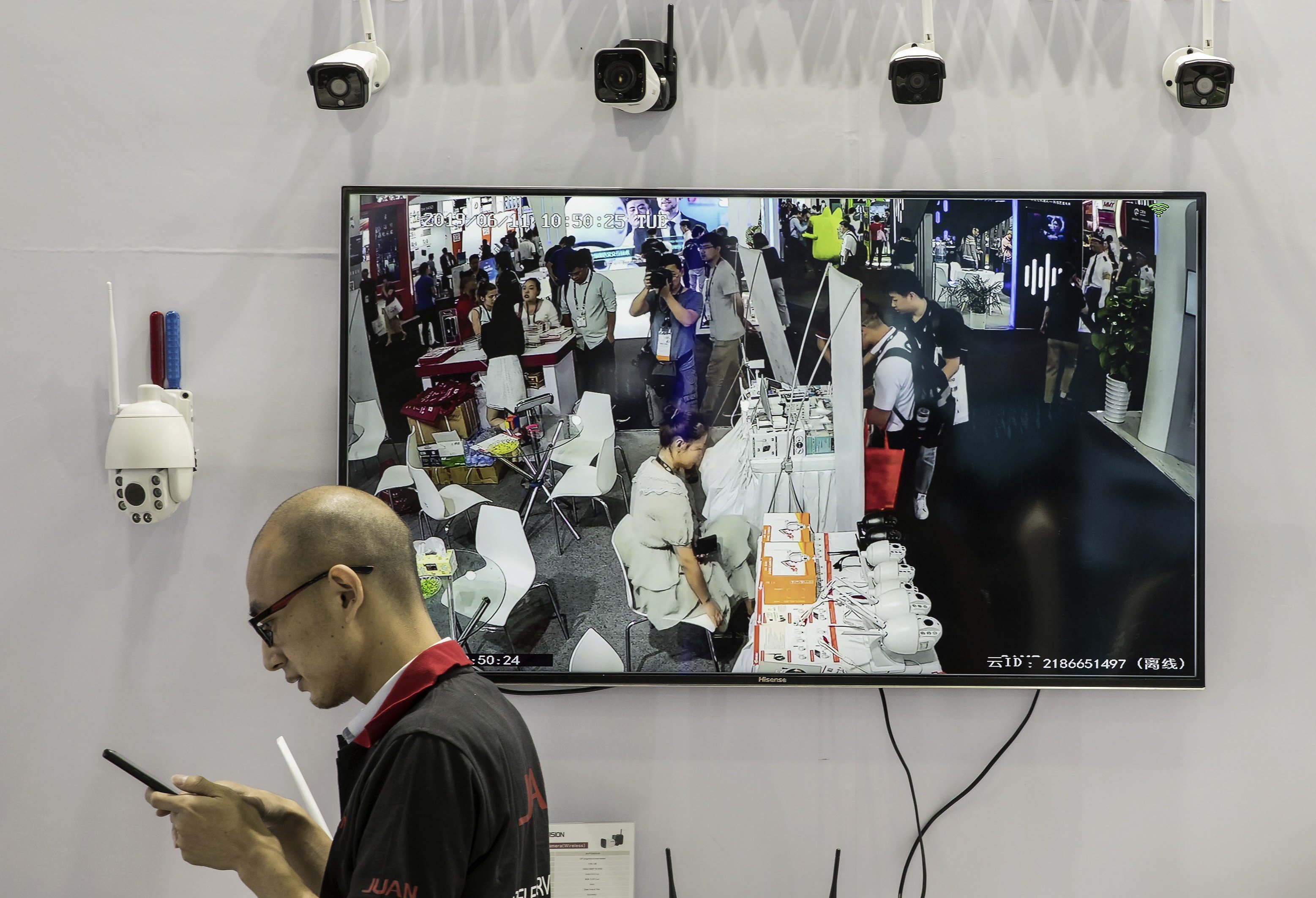 Surveillance cameras and a screen are displayed at a Guangzhou Juan Intelligent Tech Joint Stock Co. facial recognition display area during the CES Asia Show in Shanghai, June 11, 2019. Photo: Bloomberg