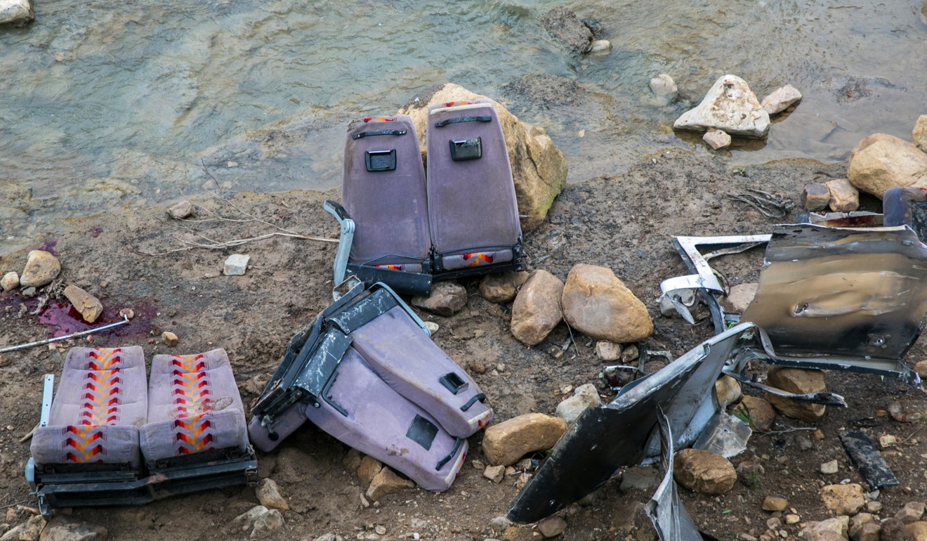 The seats from a bus that crashed during an excursion are scattered on the ground in the northern town of Amdoun, Tunisia. Photo: Reuters
