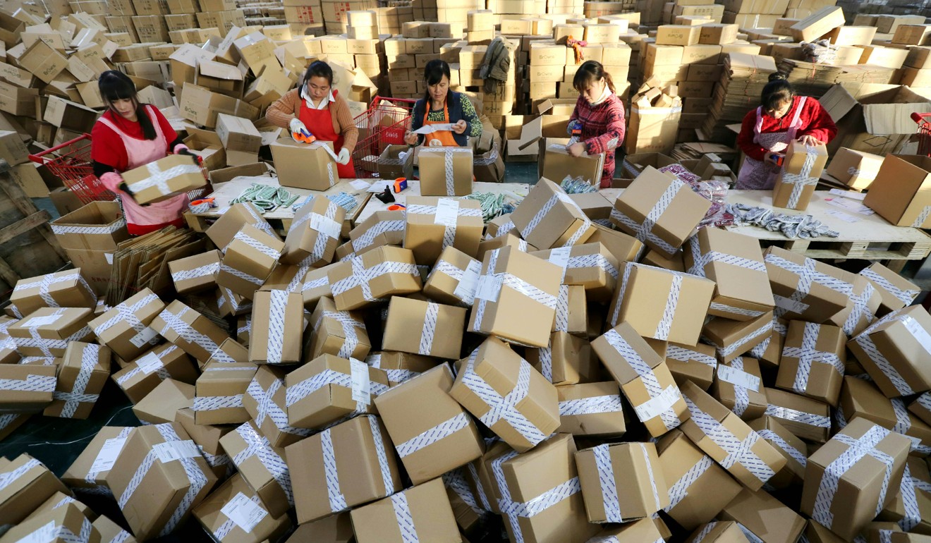 Staff at a sorting centre in China’s Jiangsu province prepare delivery packages from online orders. Complaints have risen by internet shoppers as the trend for online buying continues. Photo: AFP