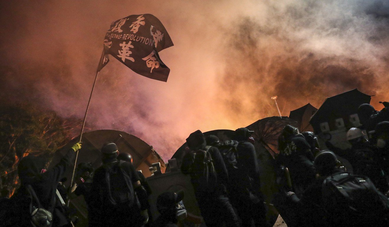 Clashes break out between riot police and students protesting as they exchange tear gas and petrol bombs at the Chinese University of Hong Kong in Sha Tin, on November 12. Photo: Sam Tsang alt=Clashes break out between riot police and students protesting as they exchange tear gas and petrol bombs at the Chinese University of Hong Kong in Sha Tin, on November 12. Photo: Sam Tsang