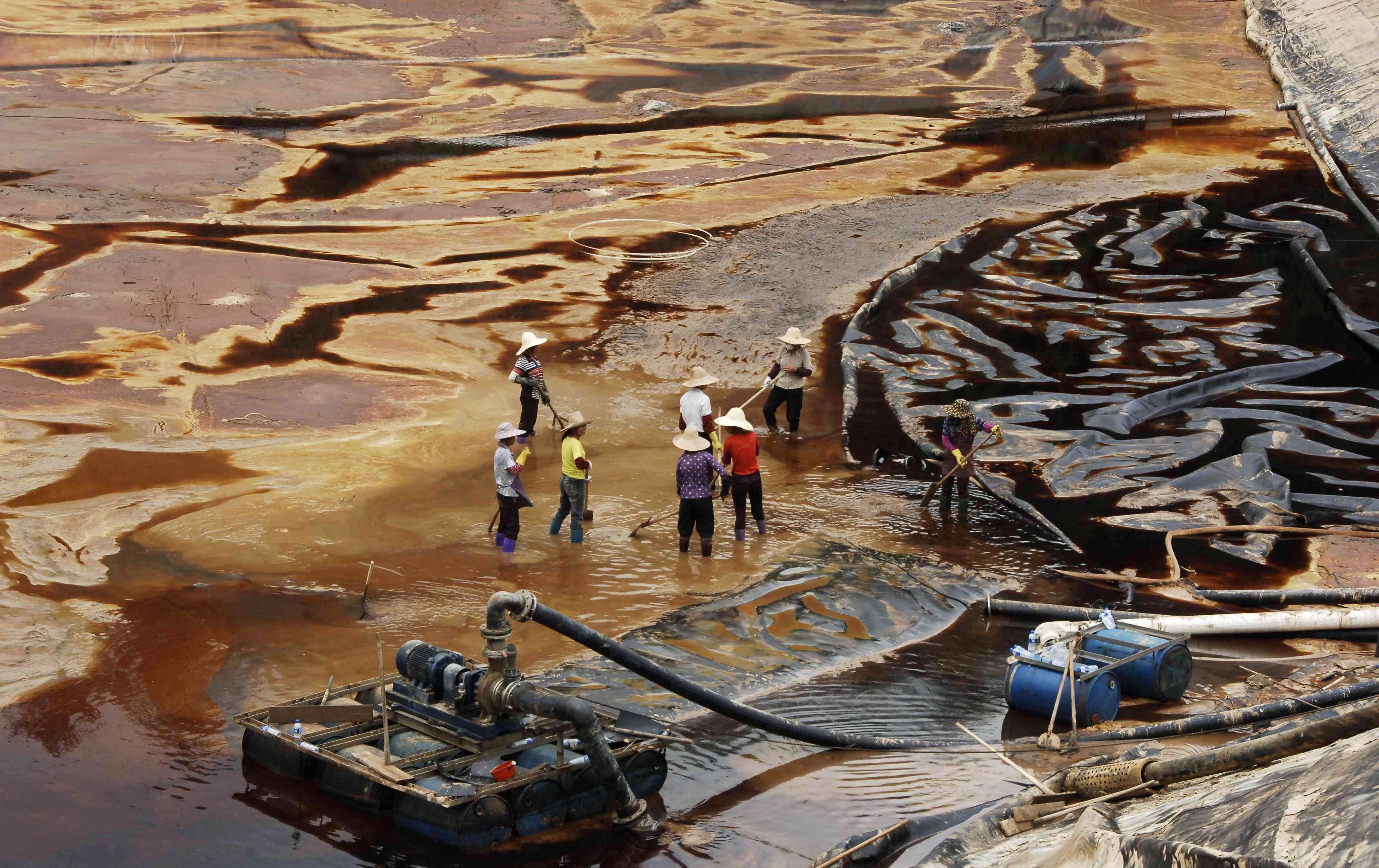 Workers near the Zijin copper mine in Shanghang in July 2010. Photo: AFP