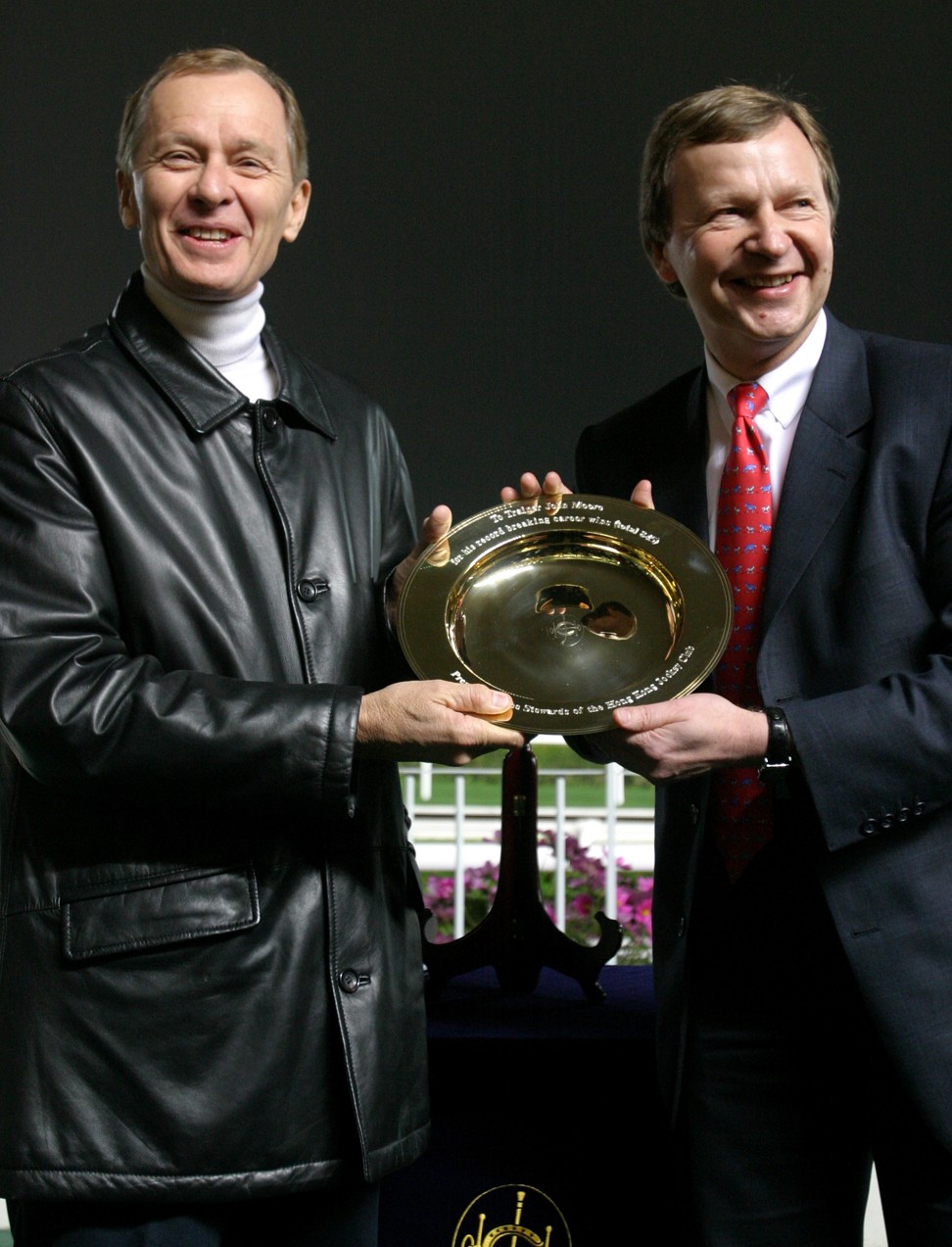 John Moore (left) with Jockey Club chief executive Winfried Engelbrecht-Bresges after breaking Brian Kan’s record for the most winners by a Hong Kong trainer in 2005.