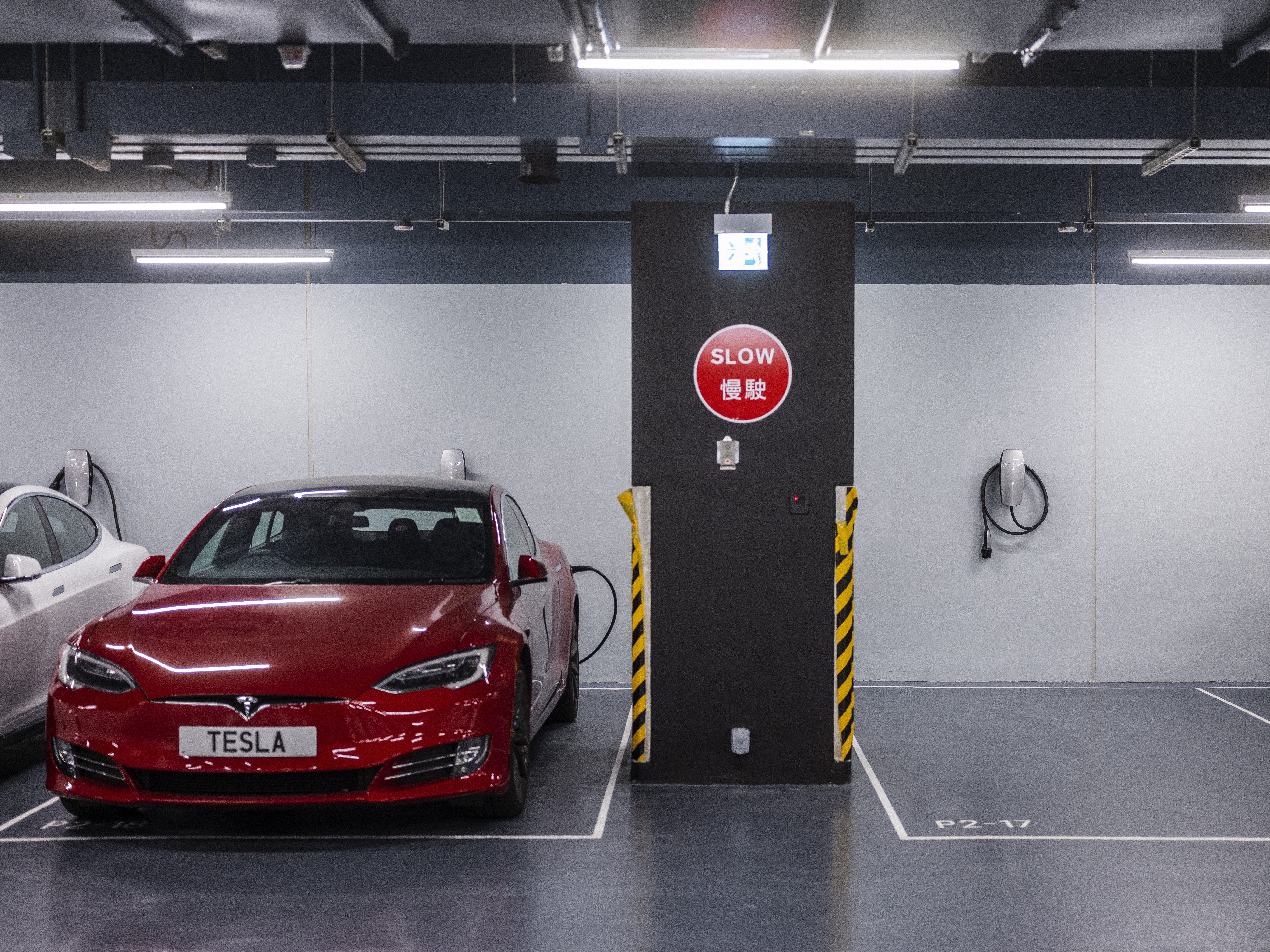 An electric vehicle gets charged at a facility in the Kowloon Bay in November 2018. Photo: Bloomberg