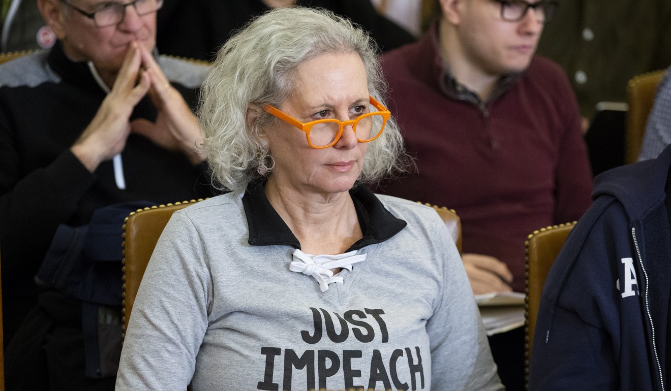 A member of the public wears a shirt that reads “Just Impeach Them All” during the US House Judiciary Committee hearing in Washington on Wednesday. Photo: EPA-EFE