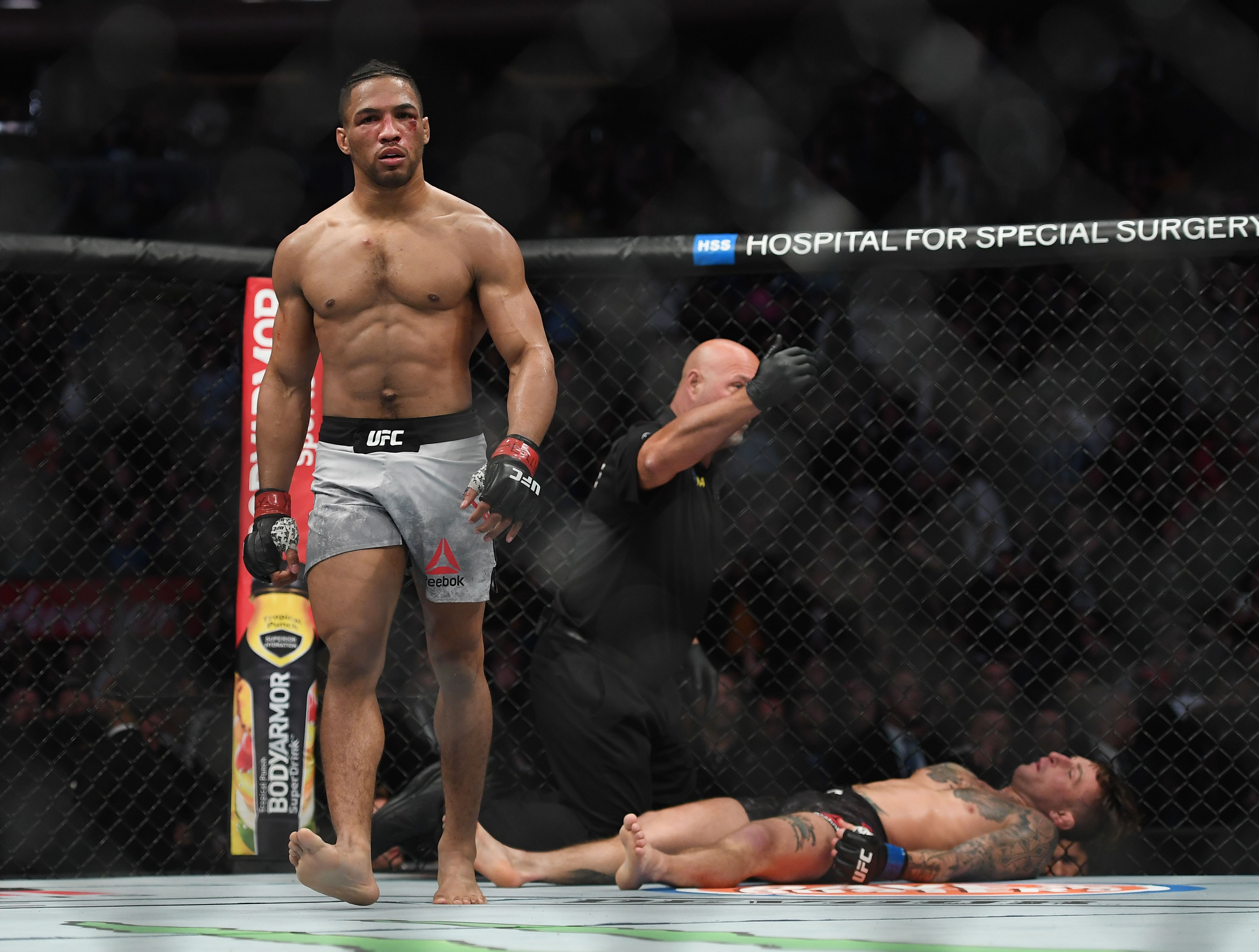Kevin Lee walks off after knocking Gregor Gillespie out with a head kick. Photo: USA TODAY Sports