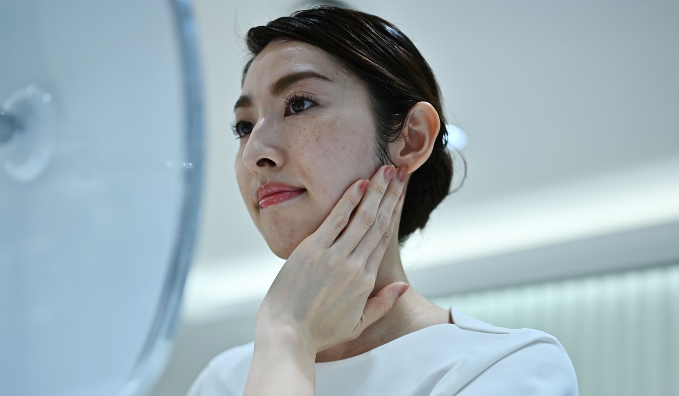 The product demonstration for the world’s first spray-on skin, using fibres one-100th the thickness of a human hair to form a membrane covering the face. Photo: AFP