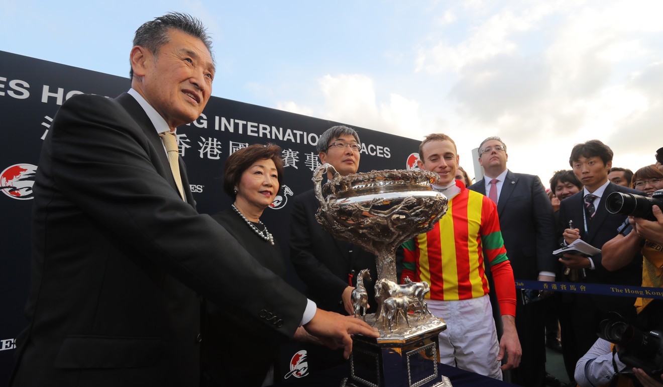 Katsumo Yoshida (left) celebrates Maurice’s Hong Kong Cup victory.