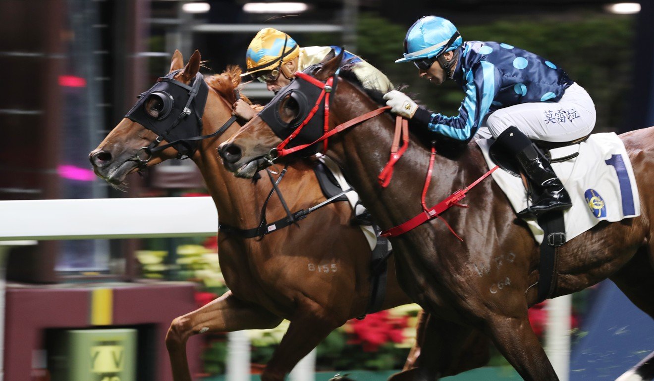 I’m The Conquist (inside) holds on to win at Happy Valley on Wednesday night.