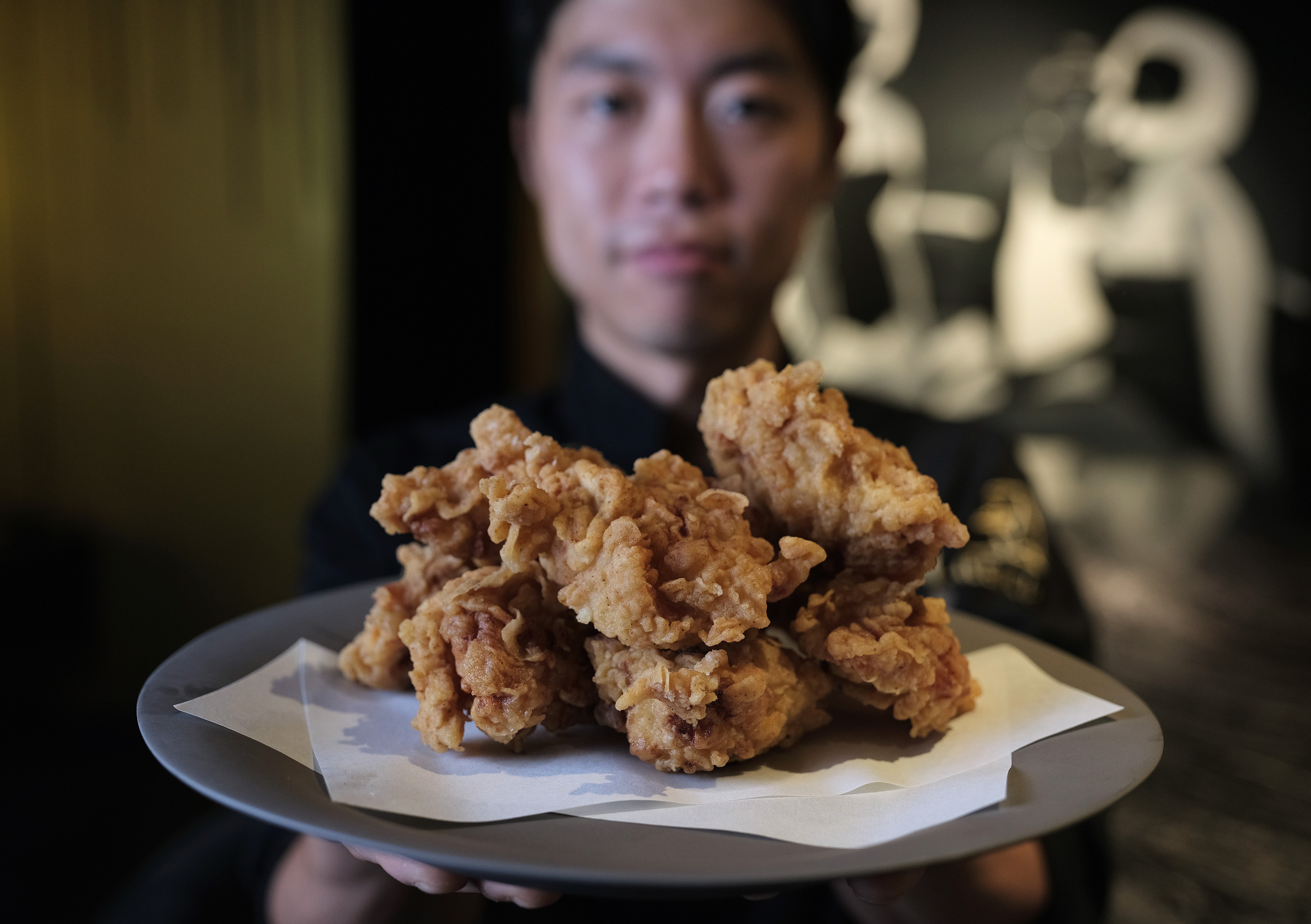 Chef Yong Soo-do with his Korean fried chicken, whose preparation includes marinating it overnight in brine, then putting it in a tempura batter with home-made chicken powder. Photo: Tory Ho