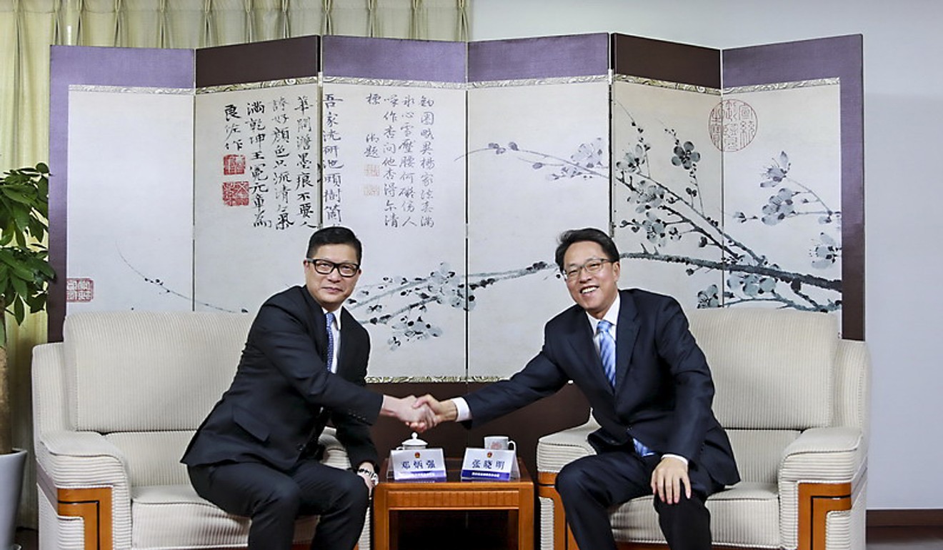 Commissioner of Police Chris Tang (left) with Zhang Xiaoming, director of the State Council’s Hong Kong and Macau Affairs Office in Beijing on Saturday. Photo: Handout