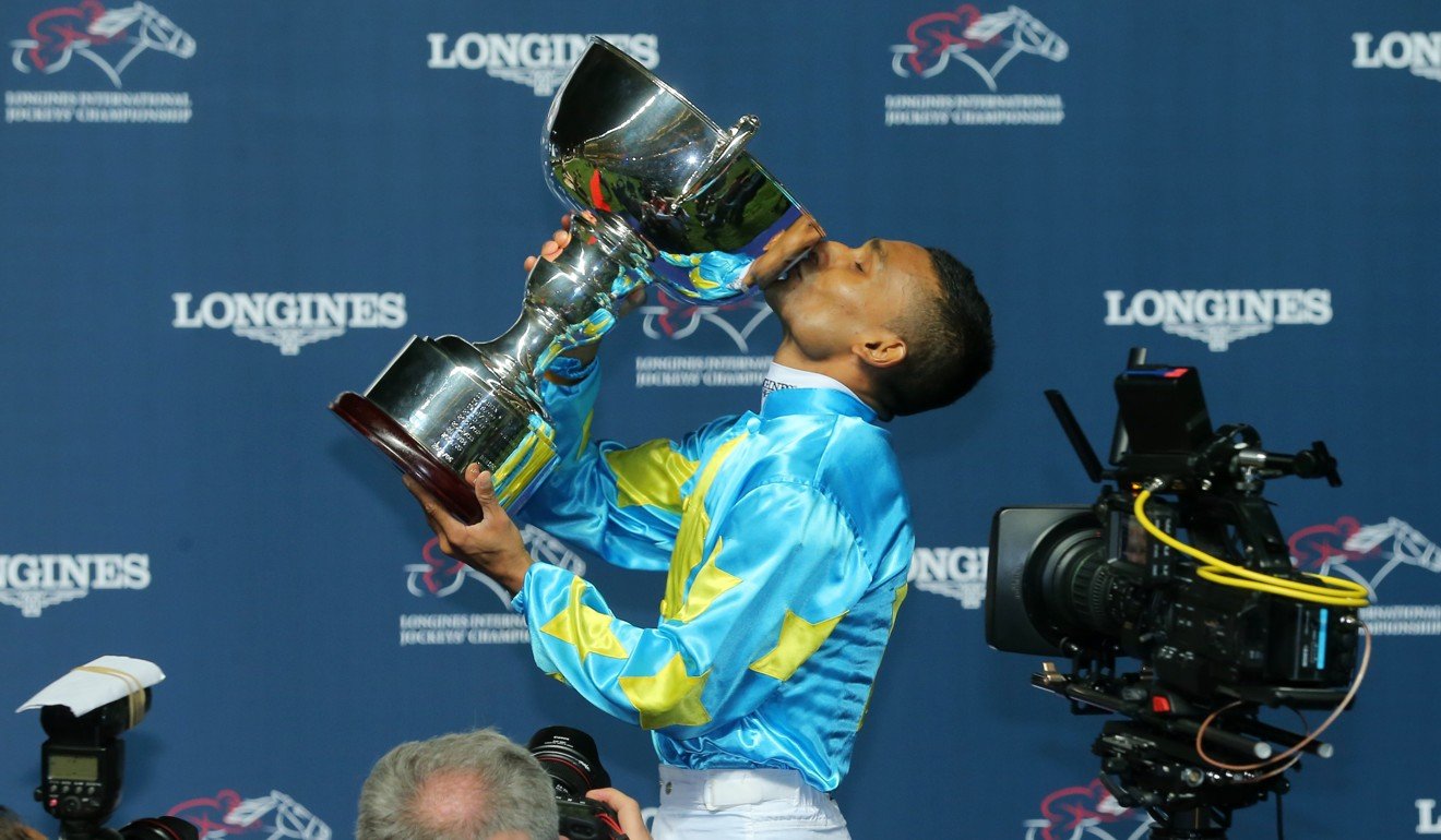 Karis Teetan kisses the trophy after winning the International Jockeys' Championship at Happy Valley.