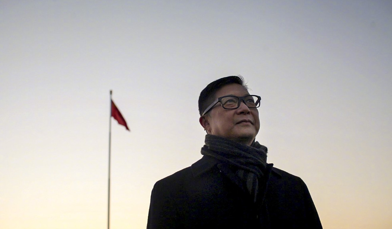 The new Hong Kong police commissioner, Chris Tang, at the national flag raising ceremony in Tiananmen Square on Saturday morning. Photo: Weibo