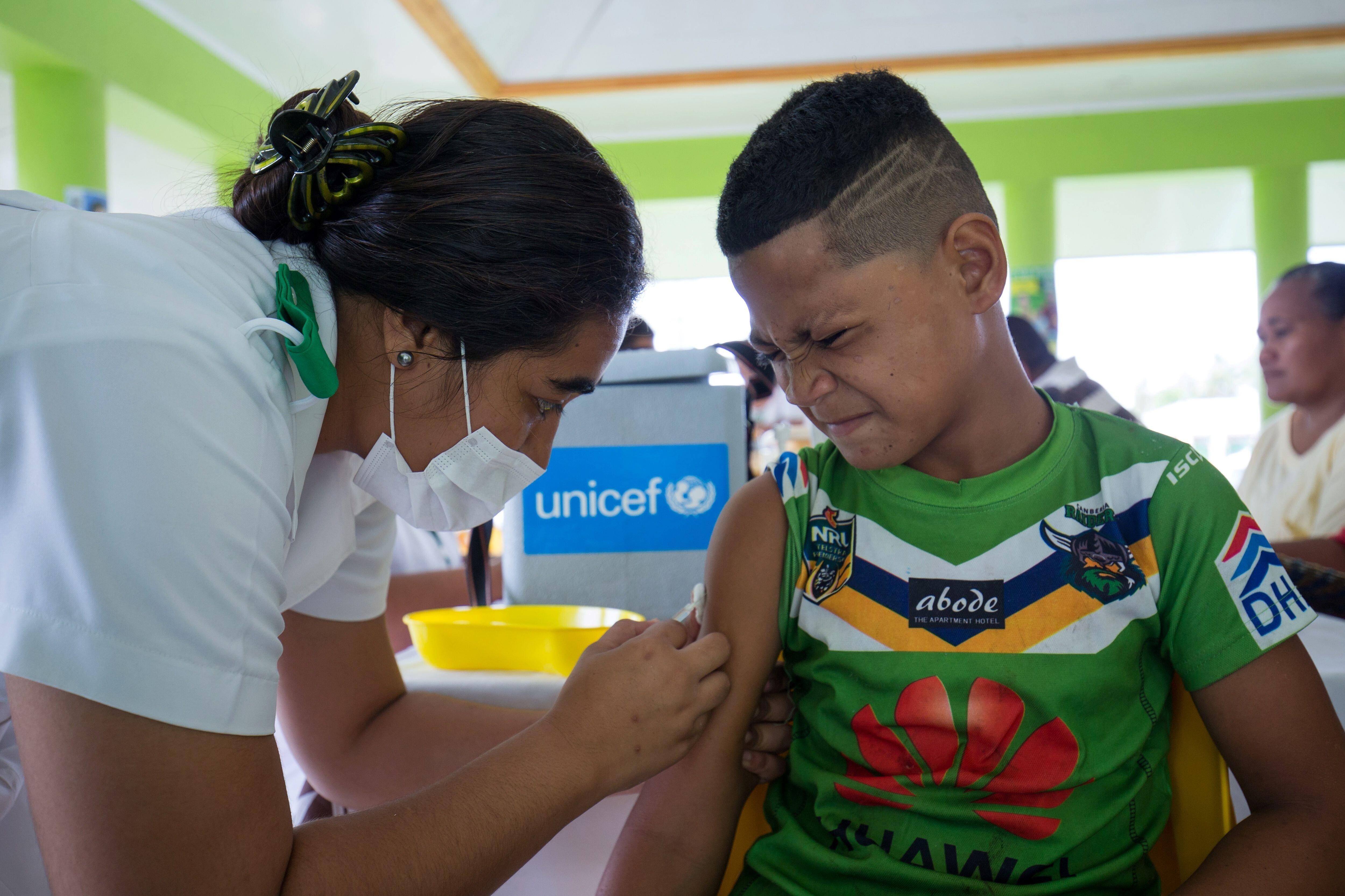 A boy receives a vaccine during a nationwide campaign against measles in Samoa. Photo: Unicef/AFP