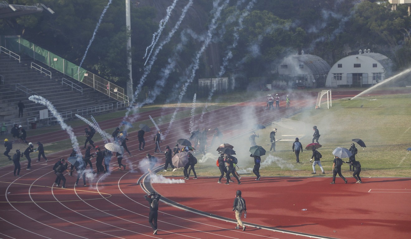 Tear gas is fired after clashes erupt between protesters and riot police at Chinese University. Photo: Winson Wong