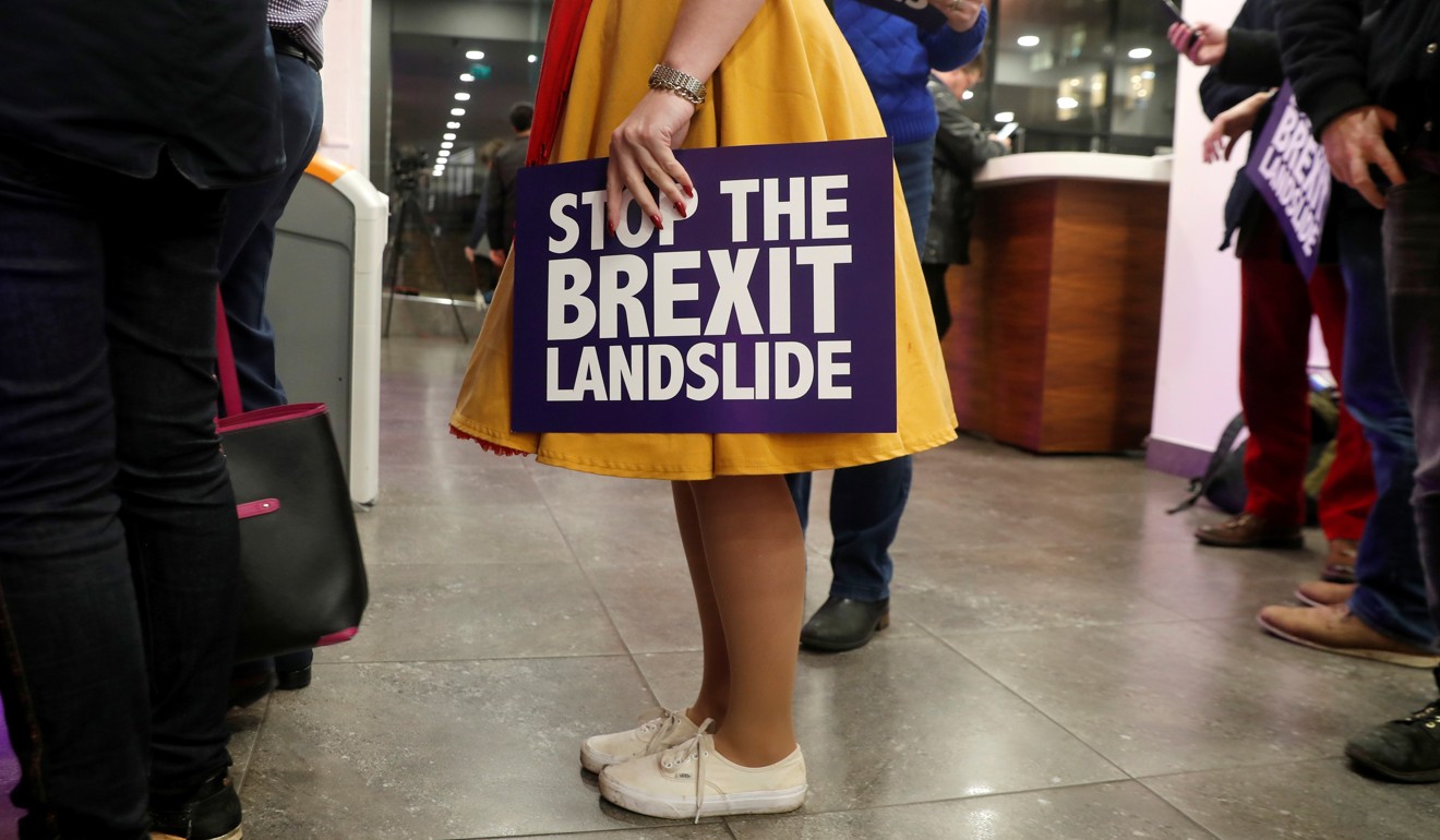 An audience member holds a placard as she attends a “Stop the Brexit landslide” rally in London on Friday. Photo: Reuters