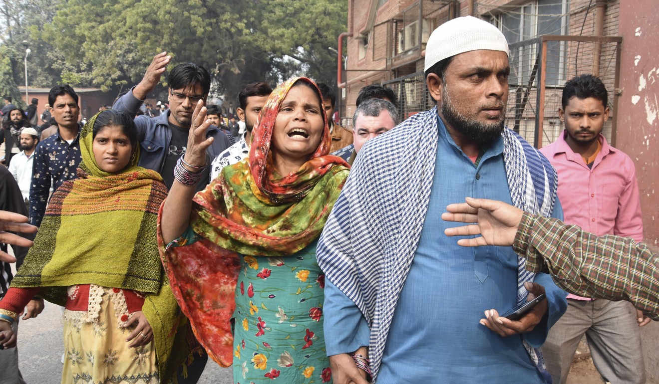 Relatives arrive to identify the bodies of their loved ones in New Delhi. Photo: AP
