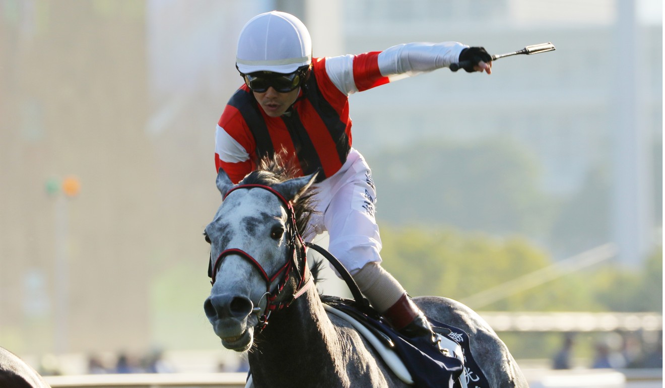 Masami Matsuoka salutes as Win Bright collects the Hong Kong Cup.