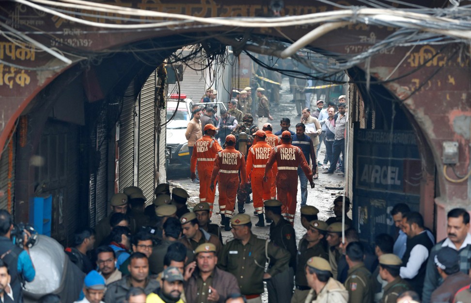 Members of India’s National Disaster Response Force at the site of a fire in New Delhi. Photo: Reuters