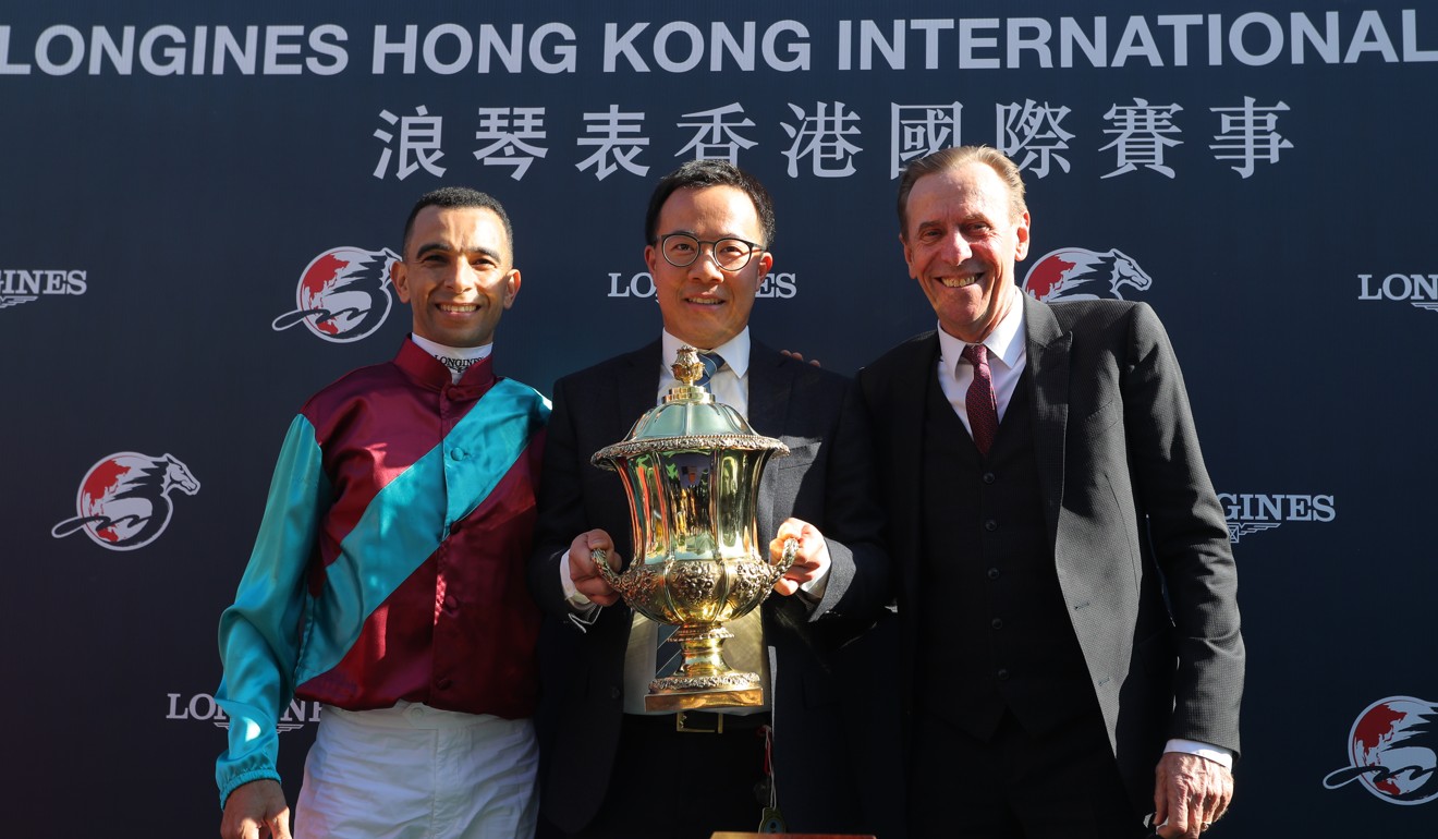 Trainer John Size (right) and jockey Joao Moreira (left) with the Hong Kong Sprint spoils.