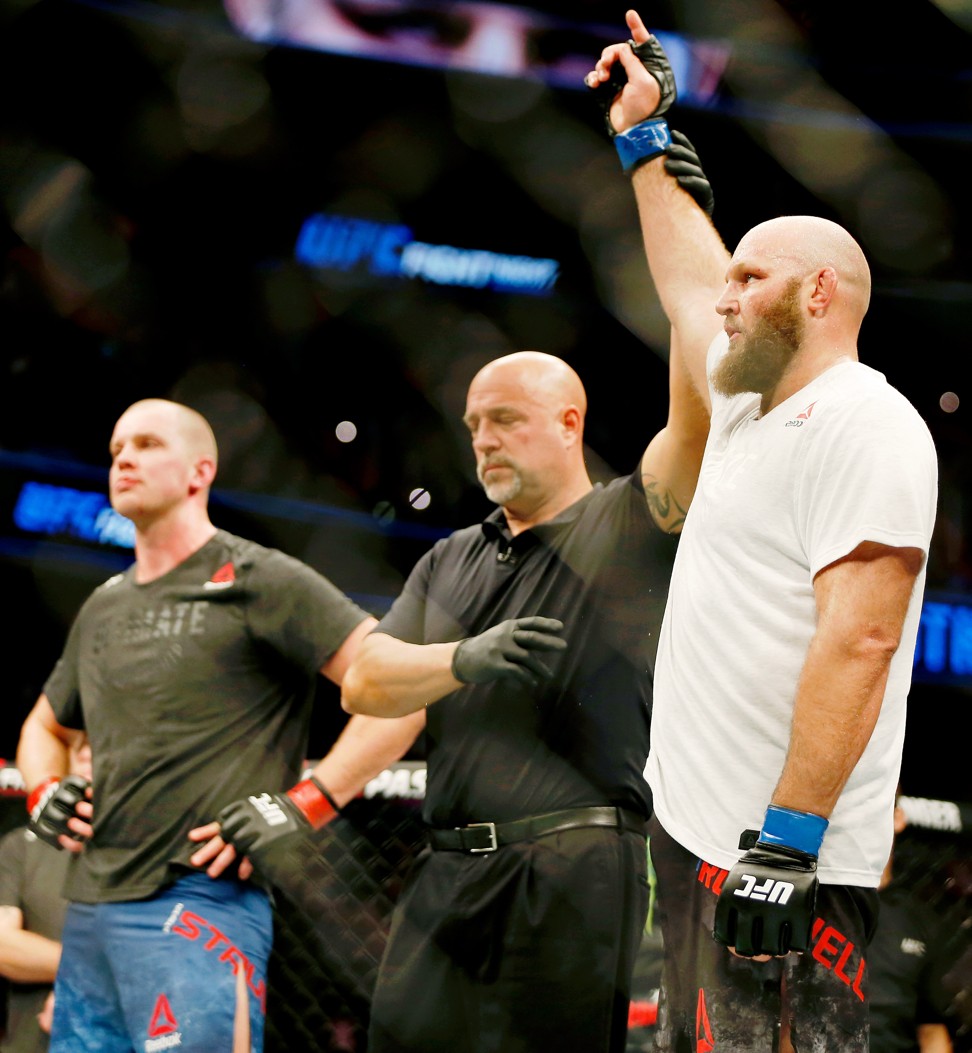 Ben Rothwell’s arm is raised after his win over Stefan Struve.