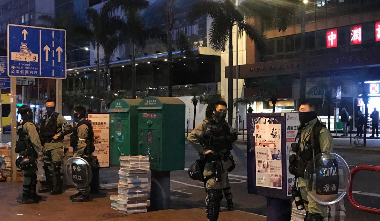 Riot police stand around in Wan Chai to see if any protesters will try and block traffic. Photo: Chan Ho-him