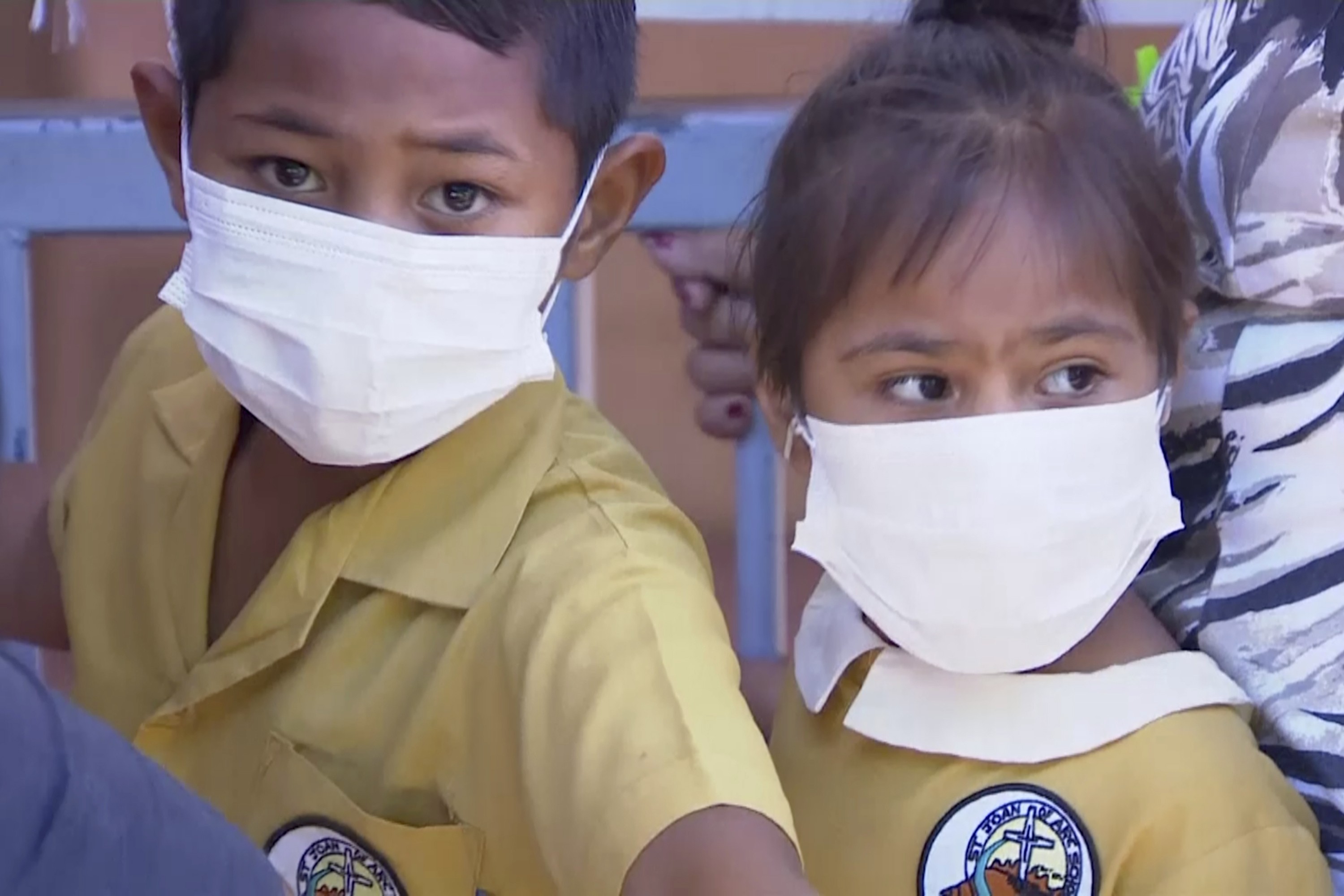 Masked children wait to get vaccinated at a health clinic in Samoa where a measles outbreak has infected nearly 4,700 people and killed more than 70, of whom more than 60 were children aged four years or younger. Photo: TVNZ via AP