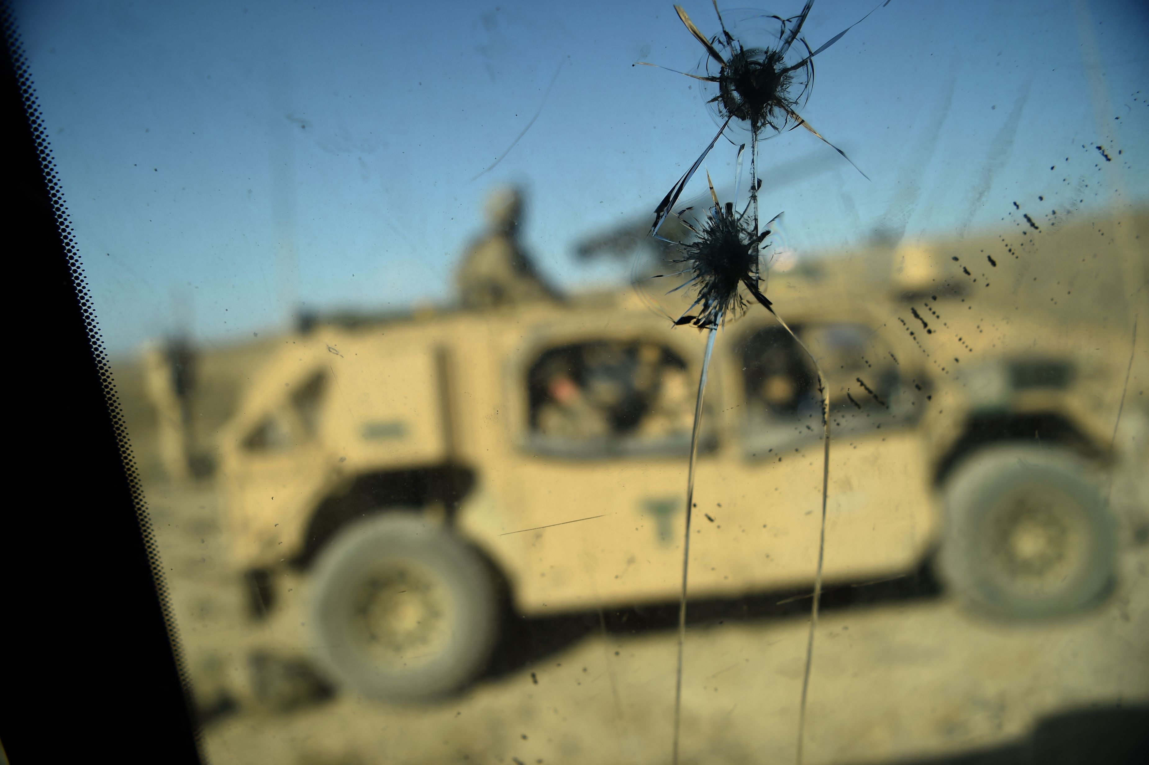 US soldiers who are part of the Nato deployment are seen through the cracked window of an armoured vehicle in Afghanistan’s Nangarhar province in July 2018. US retrenchment in Afghanistan was a campaign promise by President Donald Trump. Photo: AFP