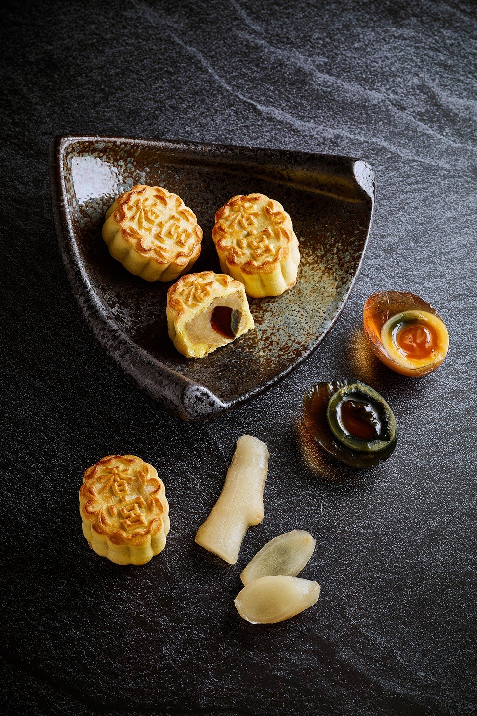 Kowloon Shangri-La make mini mooncakes with traditional and “golden” preserved eggs. The golden eggs have a more attractive golden albumen, an orange yolk and milder taste.