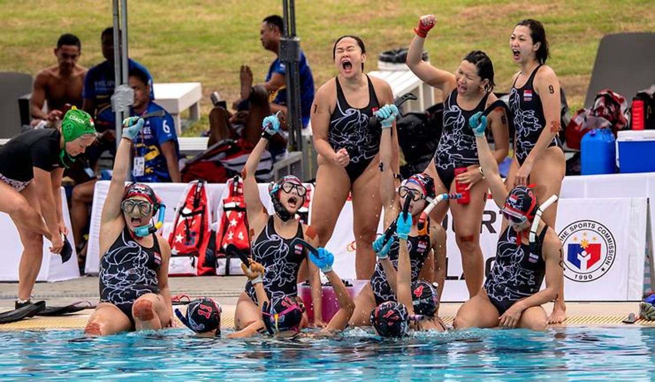 Christina Tham and her Singaporean underwater hockey teammates celebrate their triumph in Philippines. Photo: SNOC