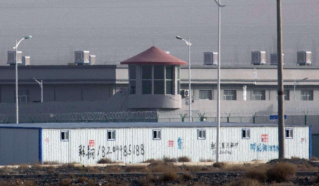 A guard tower and barbed wire fences are seen around a facility in Artux in western China’s Xinjiang region. Photo: AP