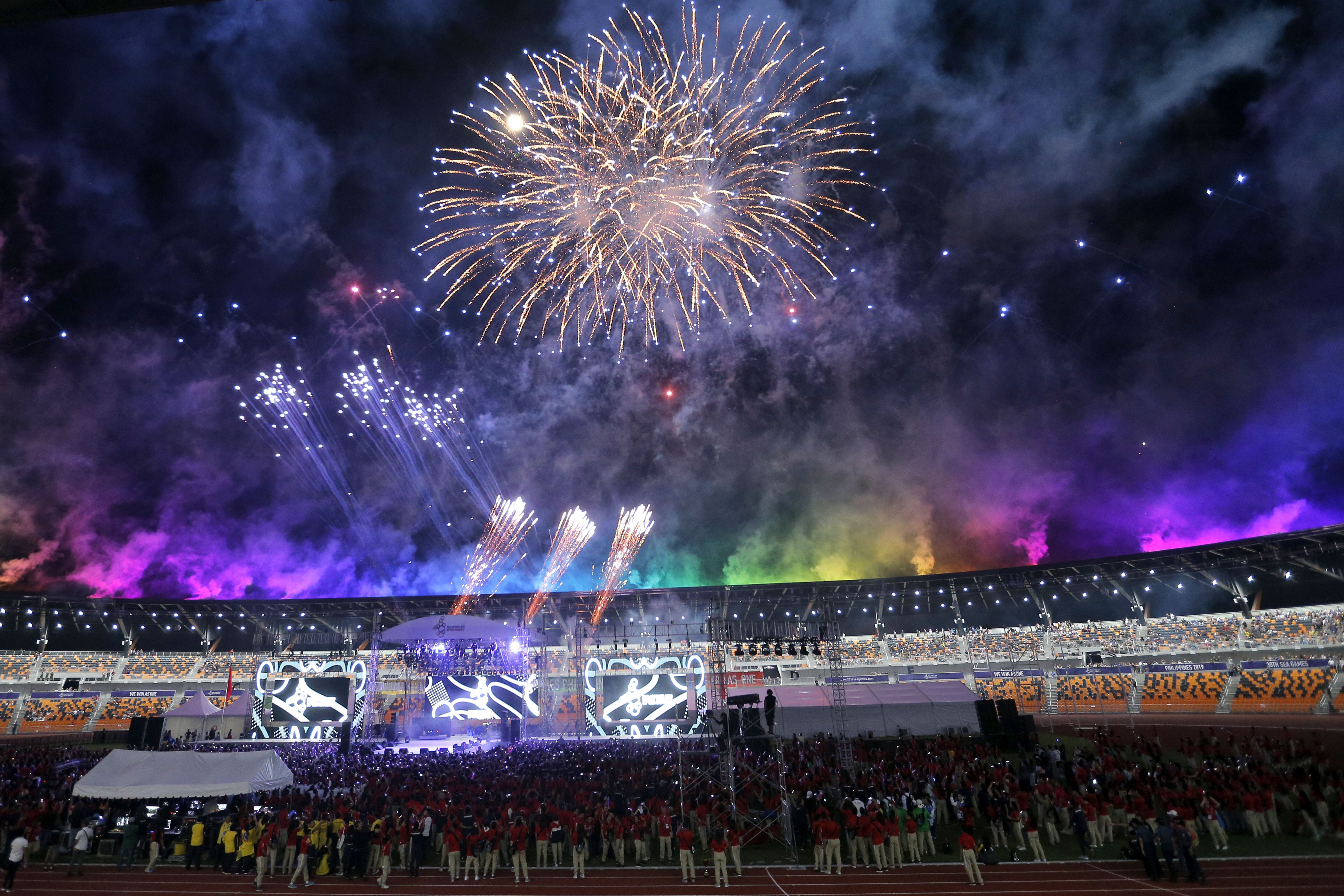 Athletes and spectators watch during the closing ceremony of the 30th Southeast Asian Games at New Clark City in northern Philippines. Photo: AP