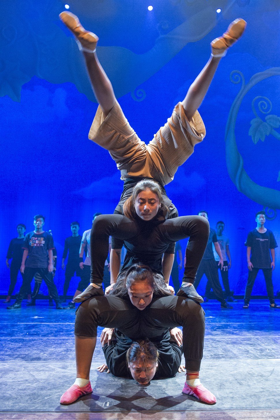Members of the Shenyang Acrobatic Troupe, including Guo Shenyu (top) and Sun Qiyue (middle), rehearse Panda: A Voyage Looking for a Dream at the Shengjing Grand Theatre. Photo: Zigor Aldama