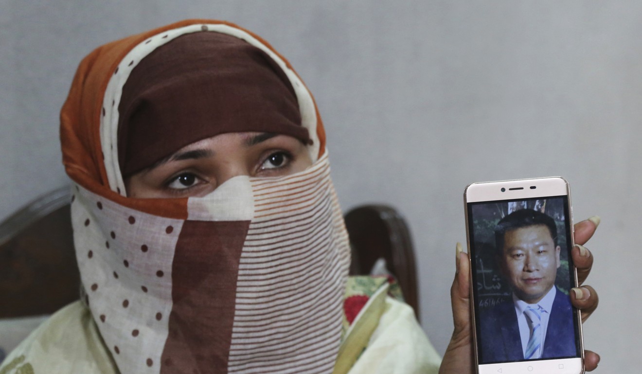 Sumaira shows a picture of her Chinese husband. Photo: AP
