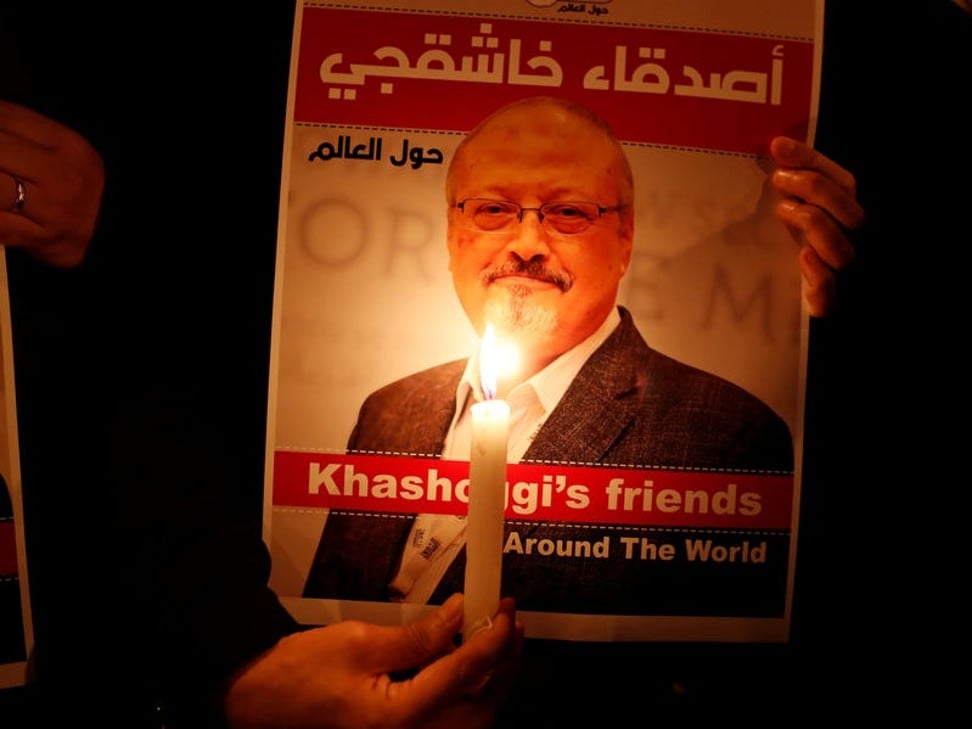 A demonstrator holds a poster with a picture of Saudi journalist Jamal Khashoggi outside the Saudi Arabia consulate in Istanbul. Photo: Reuters