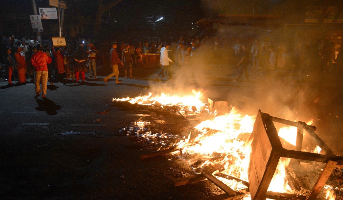 Protesters against the Citizenship Amendment Bill burn furniture on the road Guwahati Assam, India. Photo: EPA
