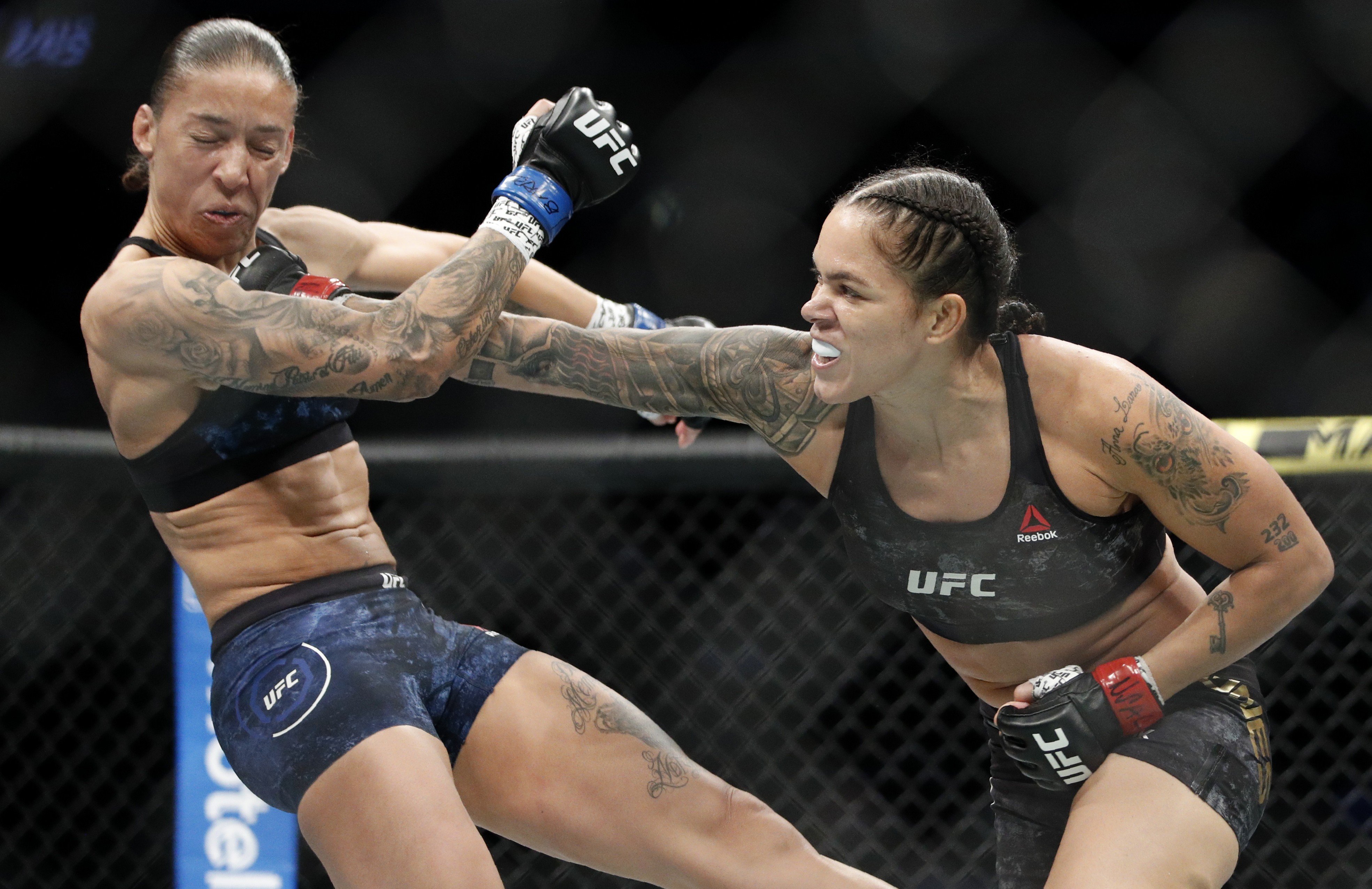 Amanda Nunes hits Germaine de Randamie at UFC 245. Photo: AP
