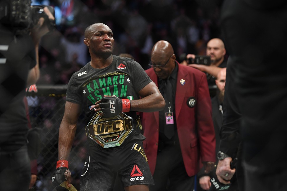 Kamaru Usman celebrates with his welterweight title after defeating Colby Covington. Photo: USA TODAY Sports