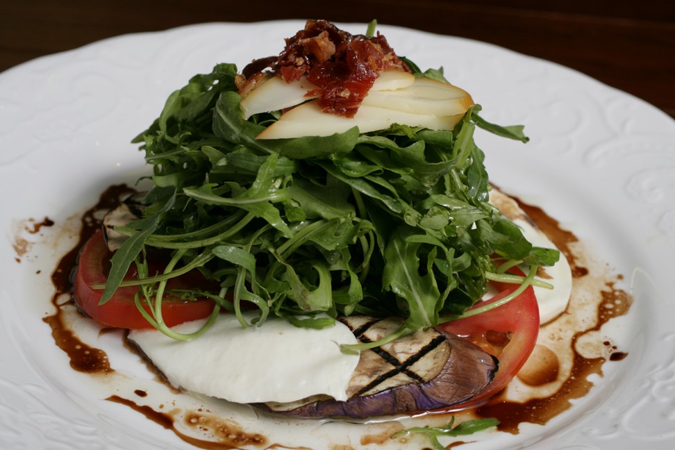 Simplylife’s oven baked smoked mozzarella with prosciutto, chargrilled aubergine, tomato rocket salad and balsamic vinegar. Photo: Edward Wong