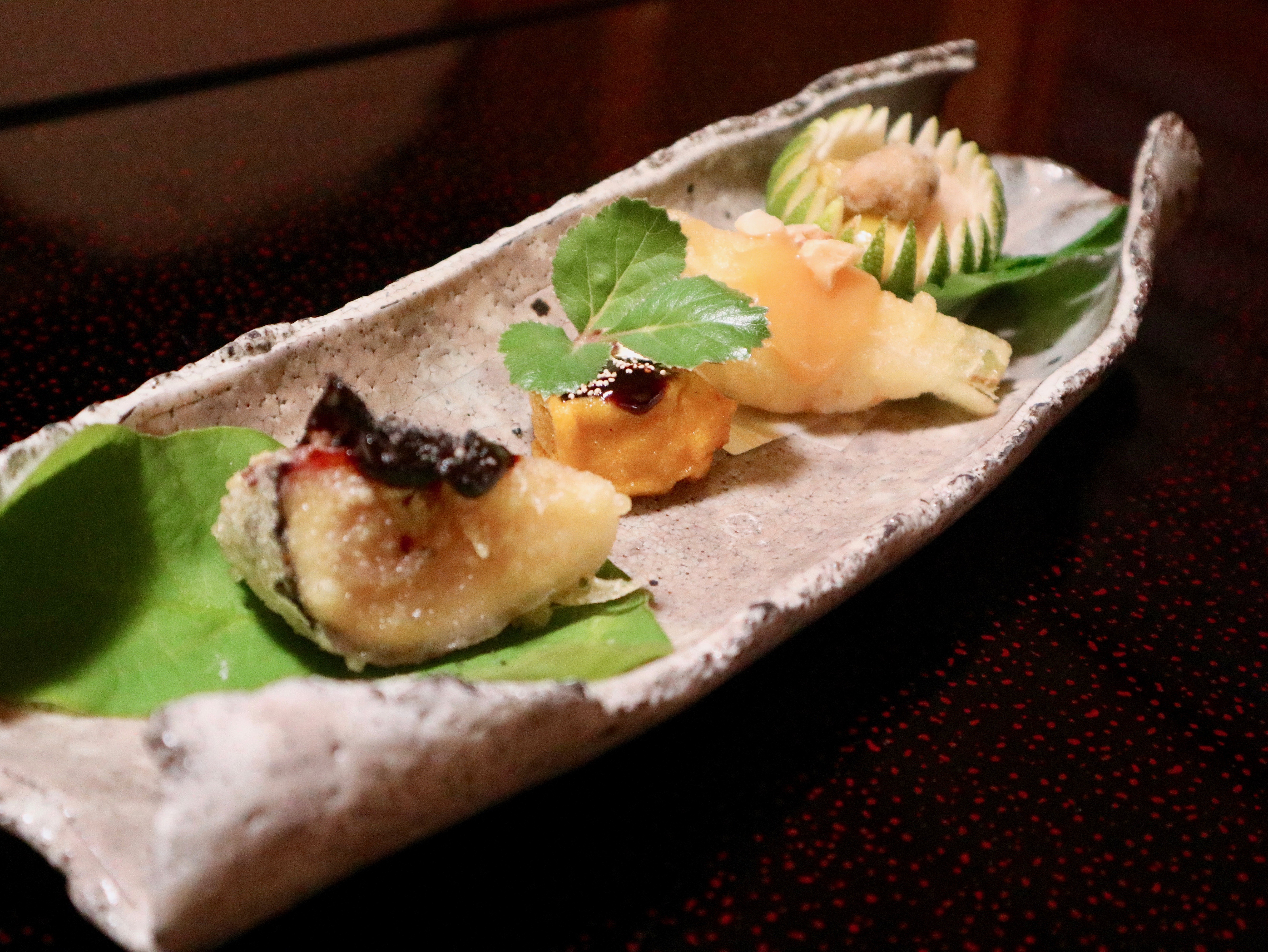 The sushi at Michelin-starred Ajiro is served with several side dishes and is elegantly prepared. Photo: Kayla Hill