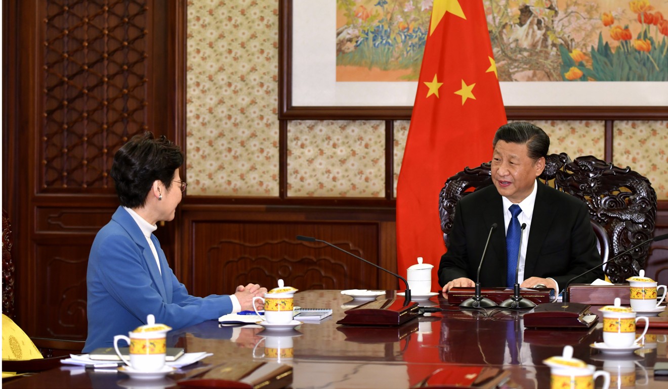 Carrie Lam briefs Xi Jinping in Beijing. Photo: Handout