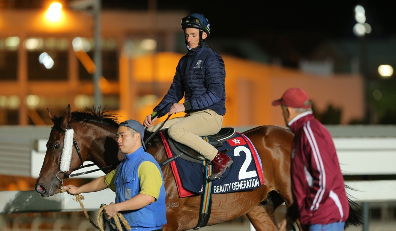 John Moore looks over Beauty Generation during trackwork.