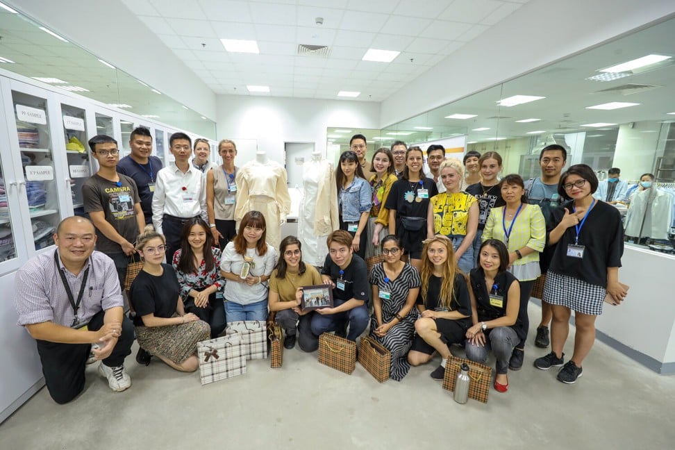 Young designers with Christina Dean, founder of Redress, at a TAL Apparel factory in Vietnam. Photo: Redress