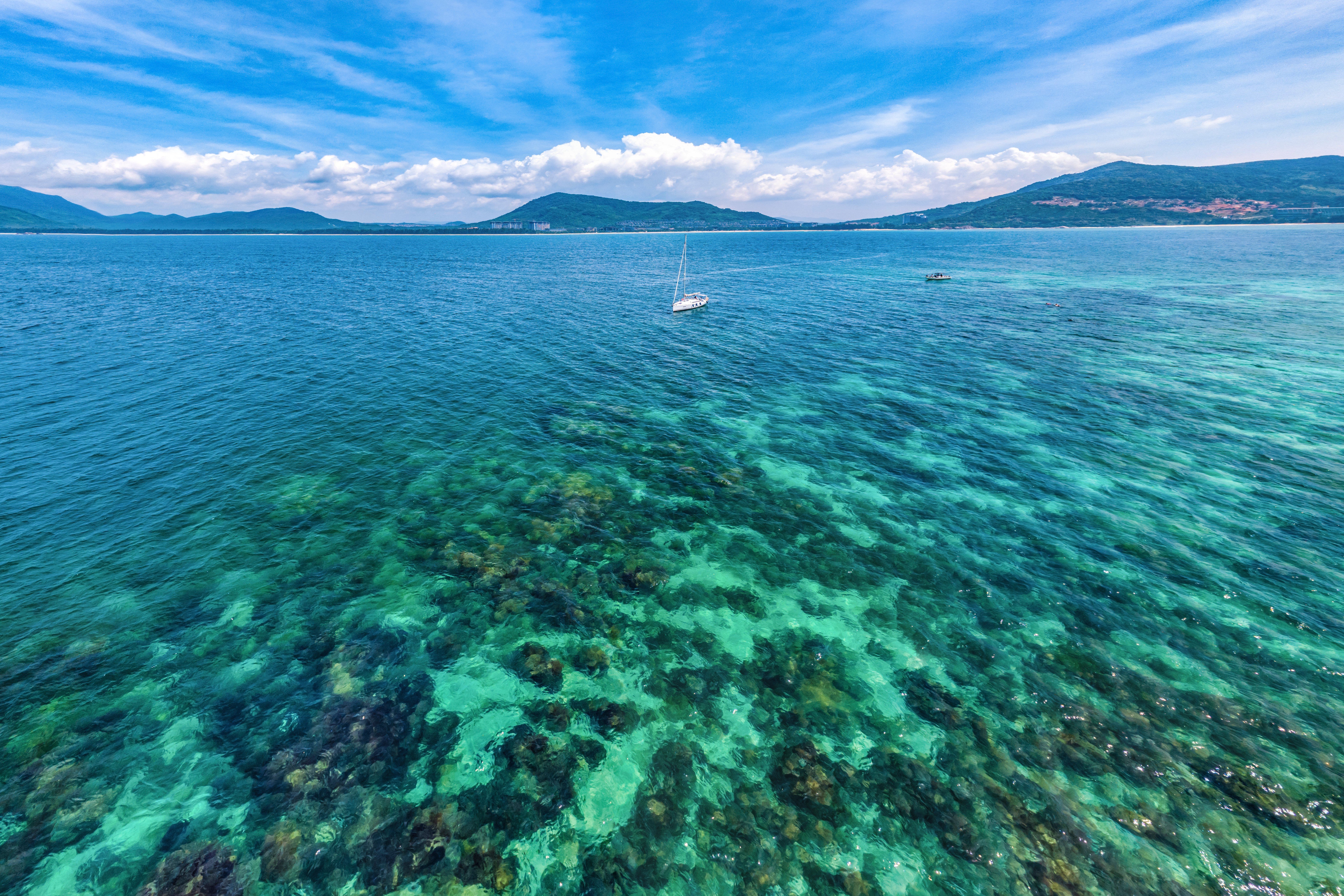 The stunning, shallow, clear blue waters off the coast of Hainan are popular with snorkellers and other holidaymakers. Photo: Shutterstock/DreamArchitect