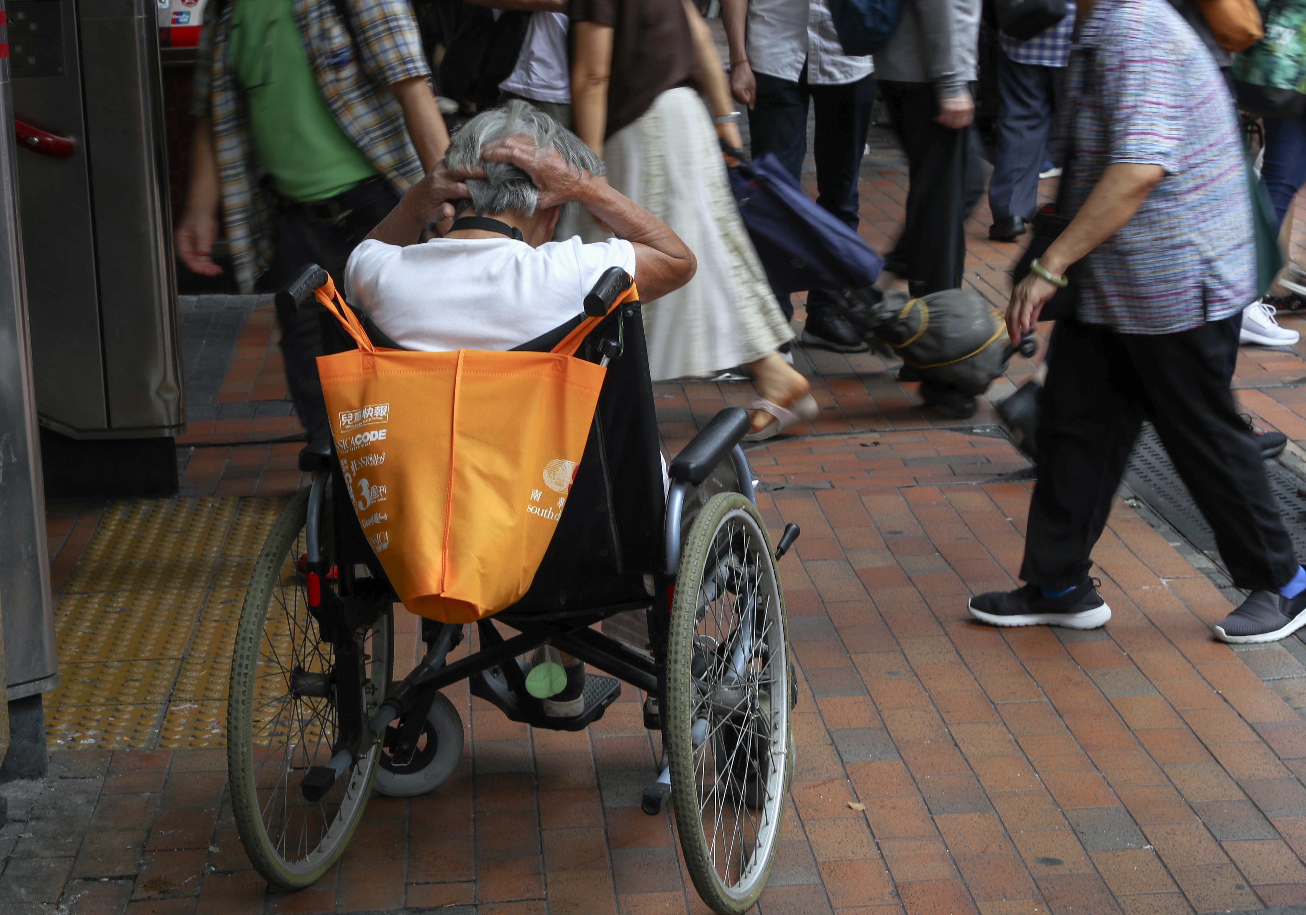 An elderly woman sitting in her wheelchair in Sham Shui Po. Photo: Edmond So
