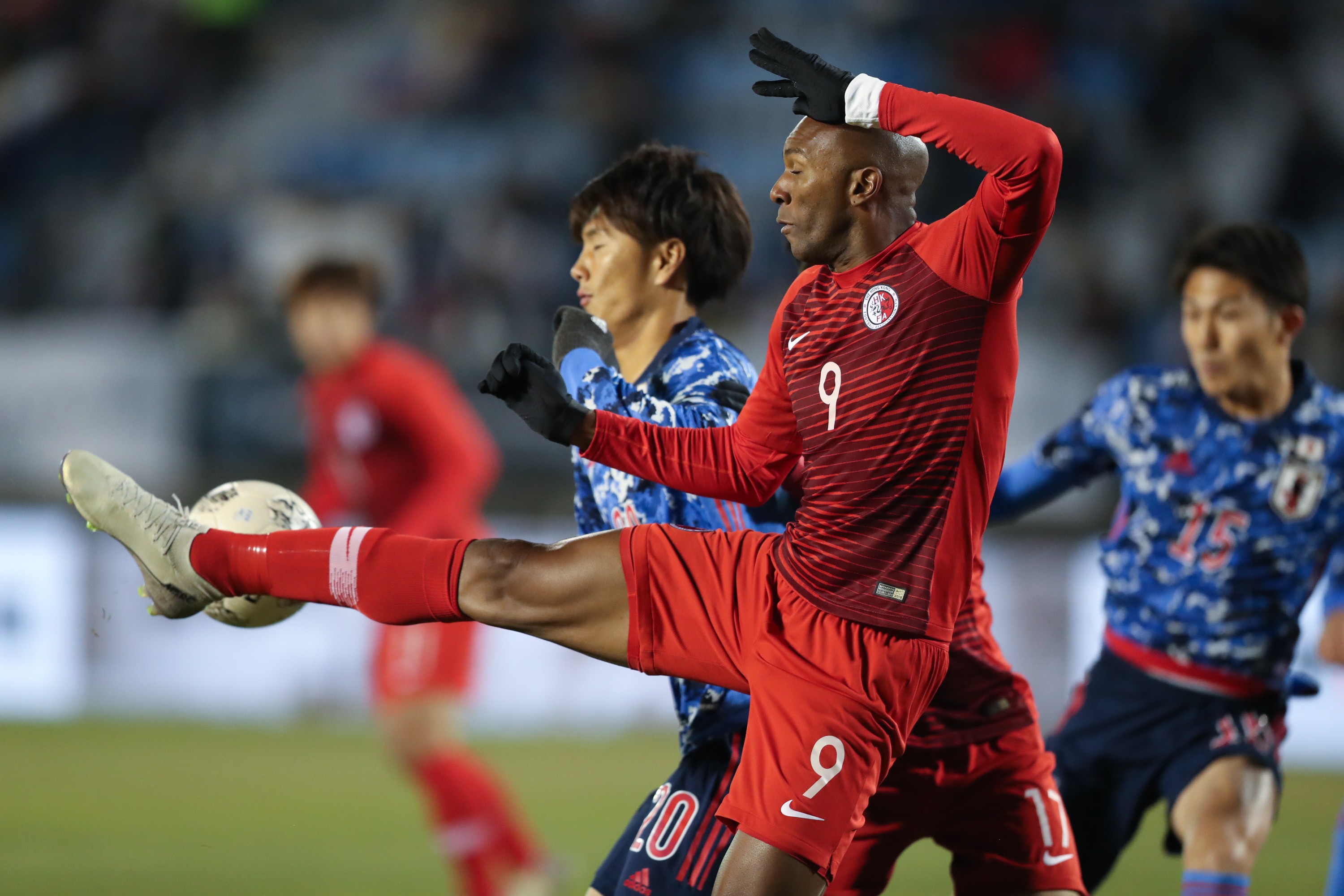 Hong Kong’s Sandro reaches for the ball against Japan’s Koki Ogawa during their EAFF E-1 clash in Busan. Photo: Xinhua
