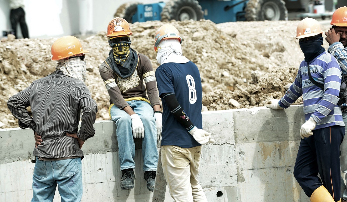 Migrant workers at a construction site in Singapore. Photo: AFP