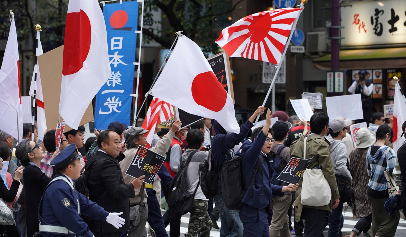 Demonstrators in Japan protest against plans to admit more foreign workers into the country. Photo: Bloomberg