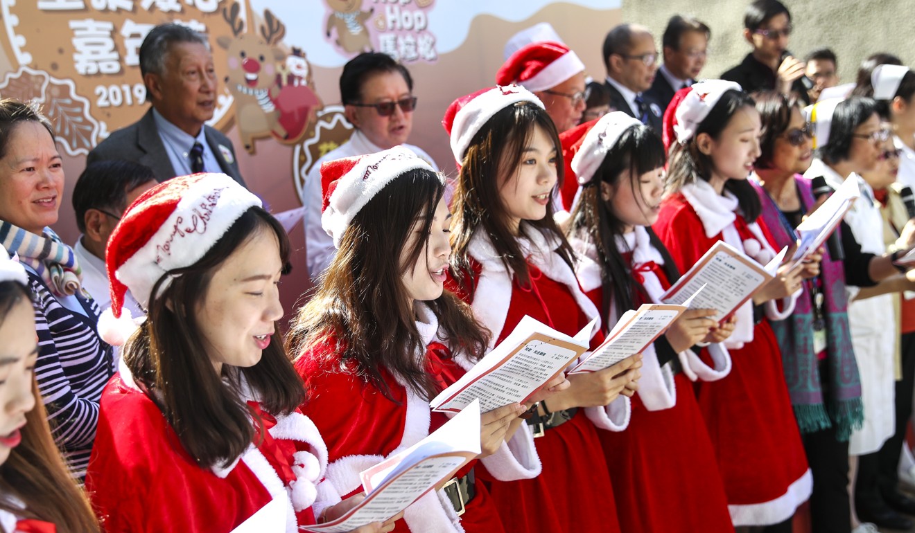 Hospital staff add to the festive cheer with their Christmas carols. Photo: Winson Wong