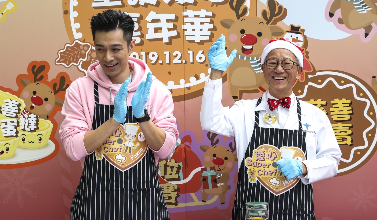 The high-tea sets prepared by singer Pakho Chau, left, and Dr Joseph Chan are later auctioned off. Photo: Winson Wong
